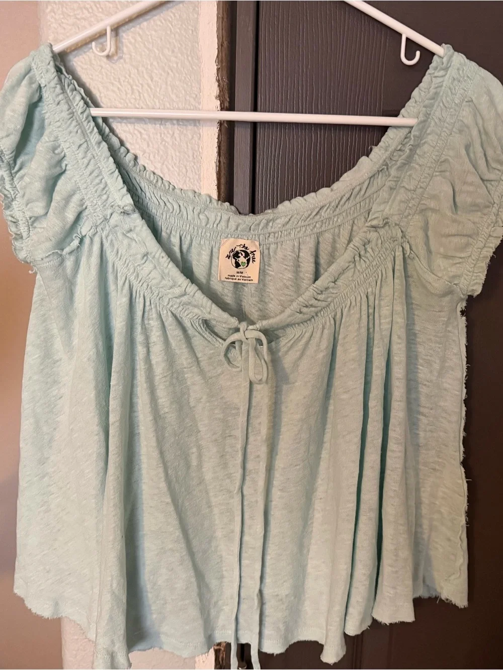 Brand new FREE PEOPLE brand.  We The Free Mint Green Peasant Tie-Front Tunic